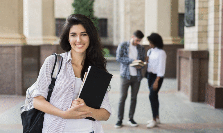 Smiling student on campus representing successful engagement through higher ed event planning